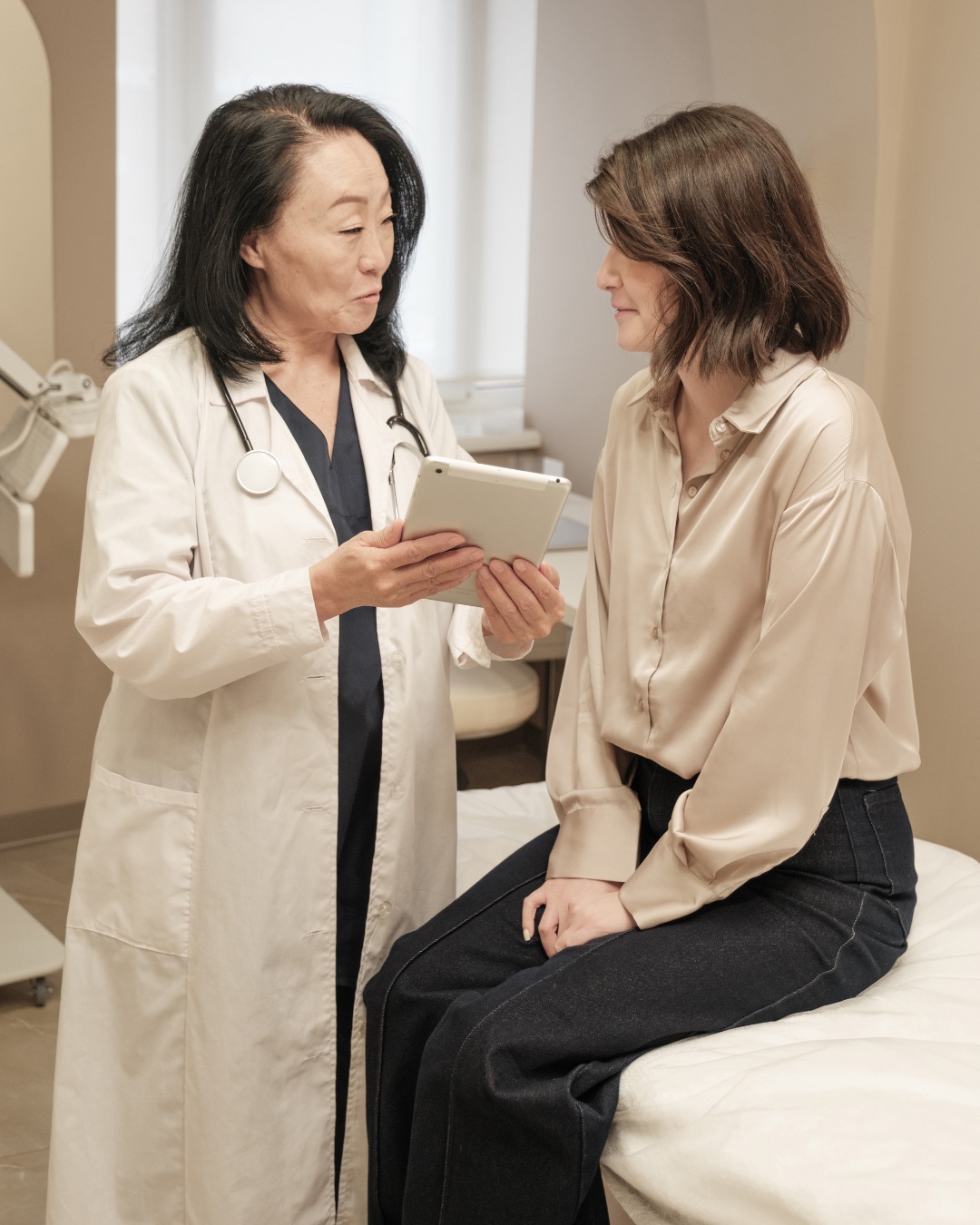 Doctor showing patient information on a tablet